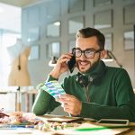 designer-speaking-by-phone-LSVMU6Y.jpg