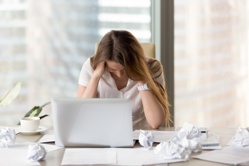 stressed female in front of laptop 