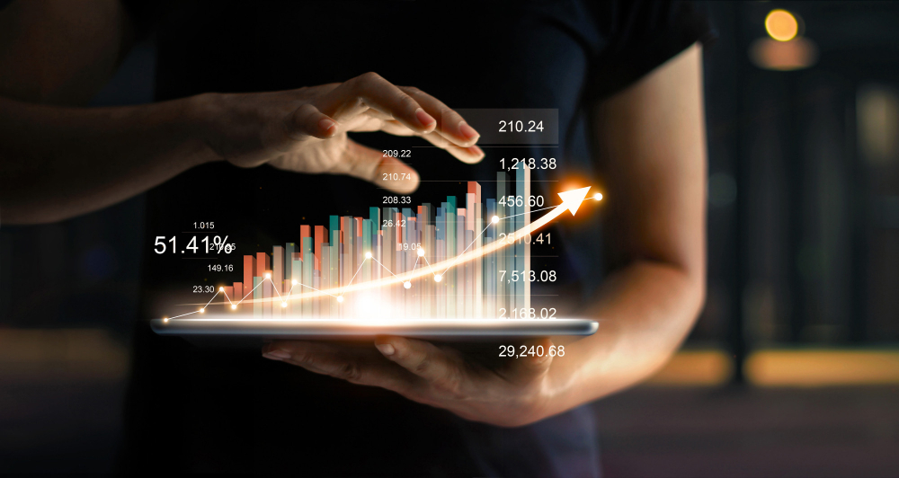 hands holding a virtual Marketing Statistics Chart